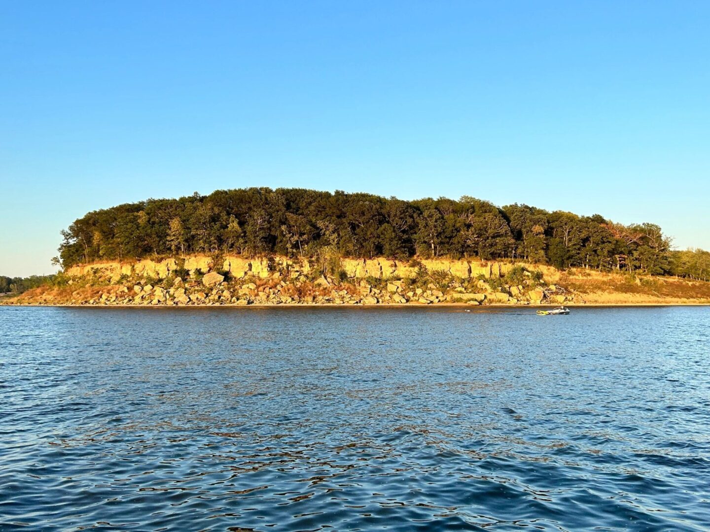 A body of water with trees on top of it.