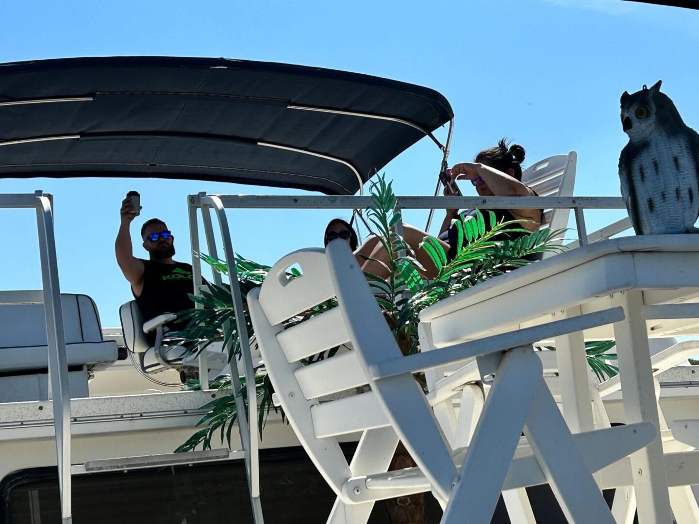 A couple of people sitting on top of a boat.