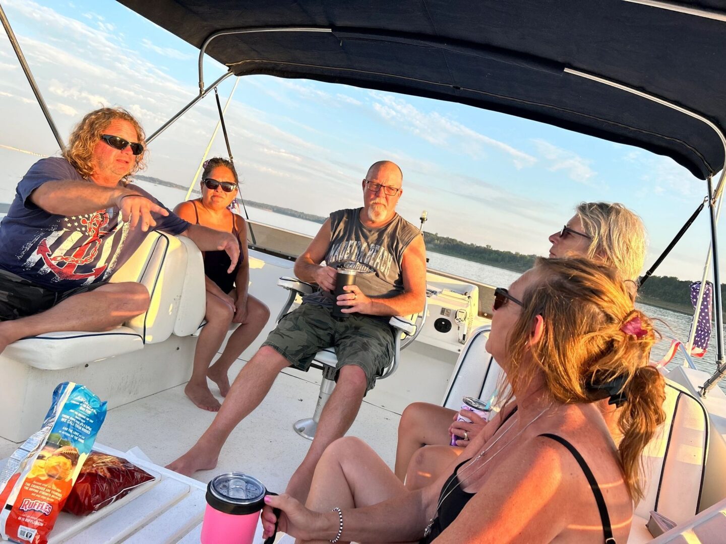 A group of people sitting on top of a boat.