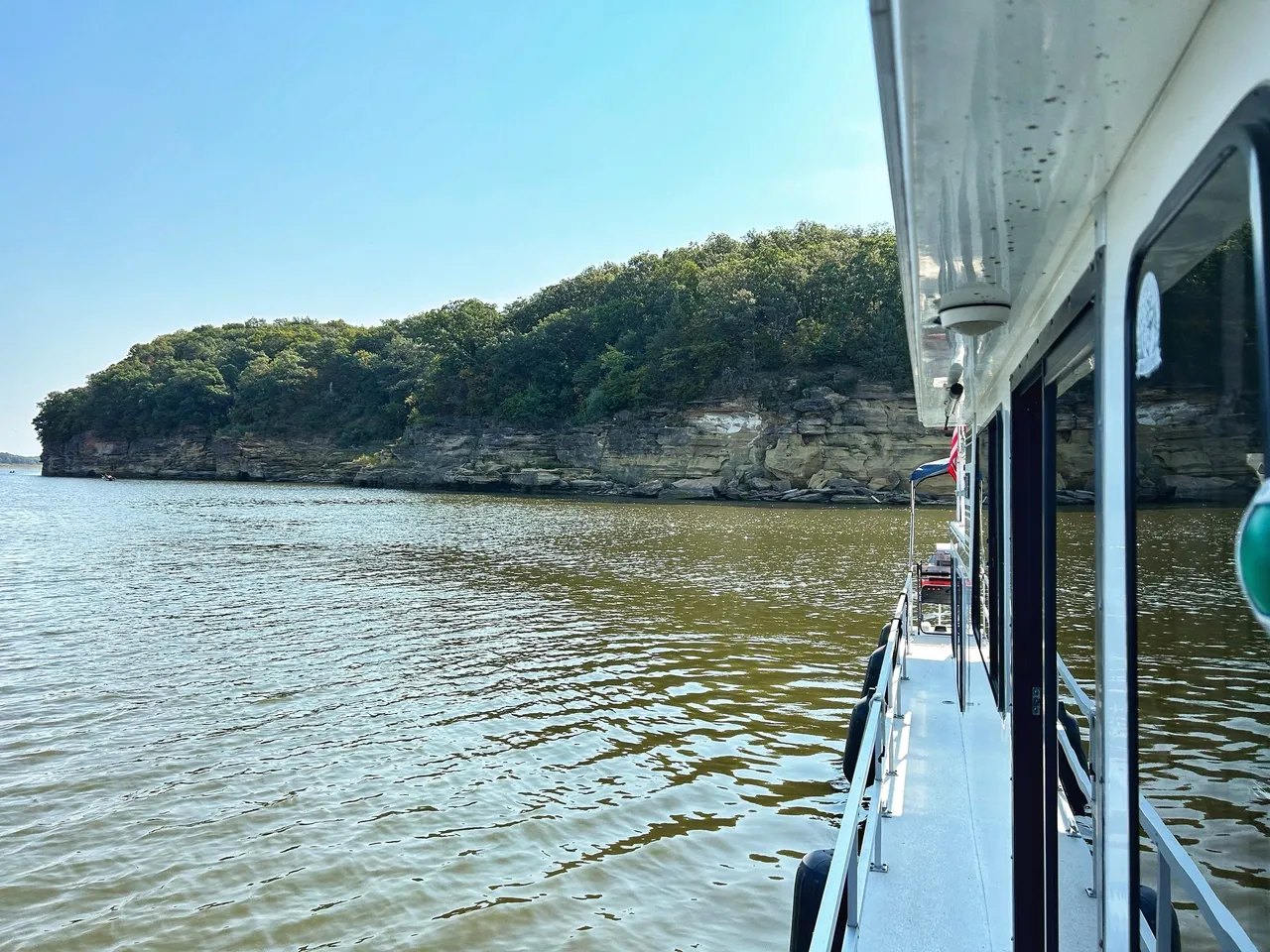 A boat is traveling down the river.